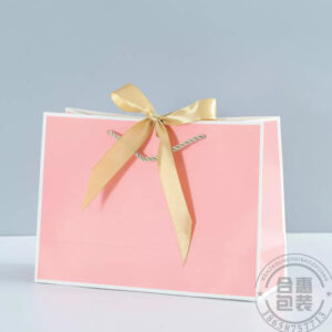 Pink plain paper bag with ribbon